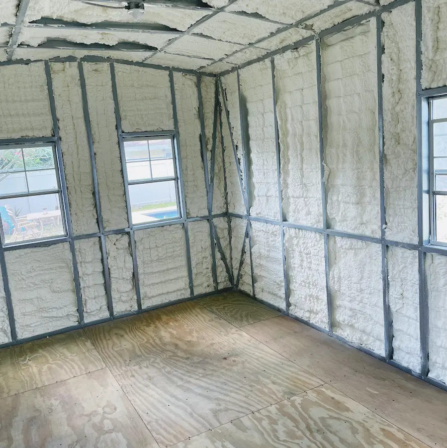 Closed-cell spray foam insulation applied to wall cavities in a residential project in Rome